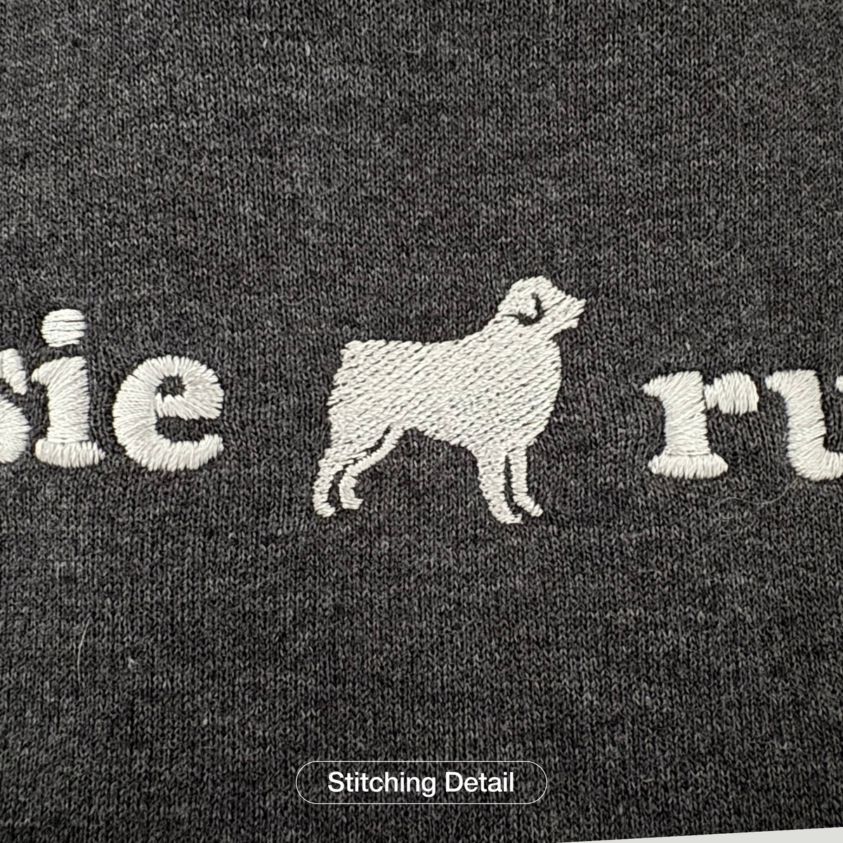 Extreme close-up of embroidery thread detail on a Super Unleashed sweatshirt