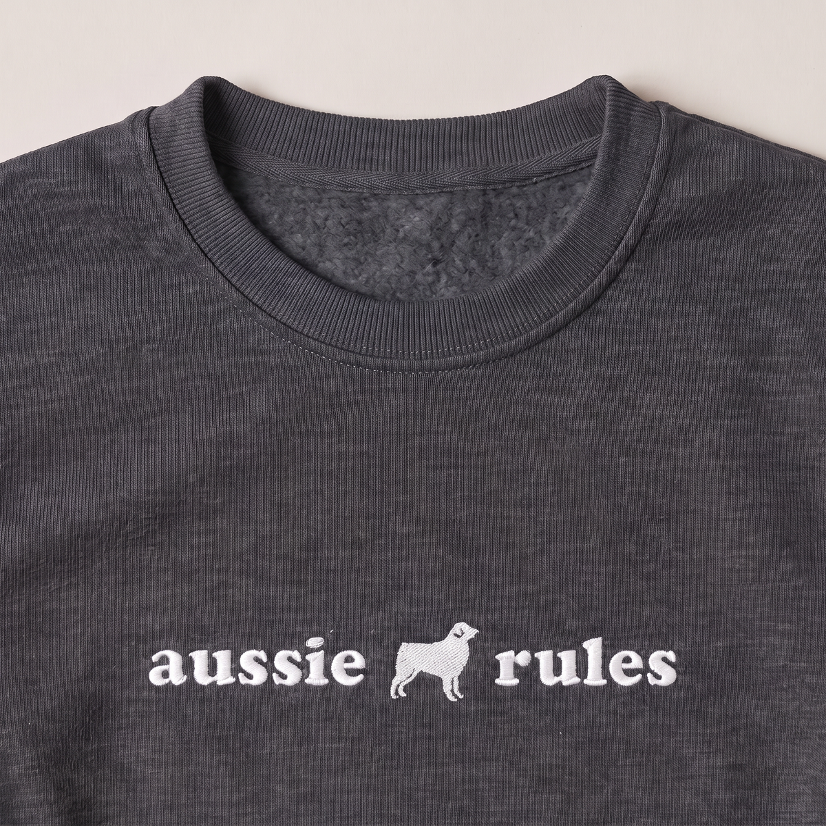 Aussie Rules Australian Shepherd embroidered sweatshirt, close-up of the embroidery