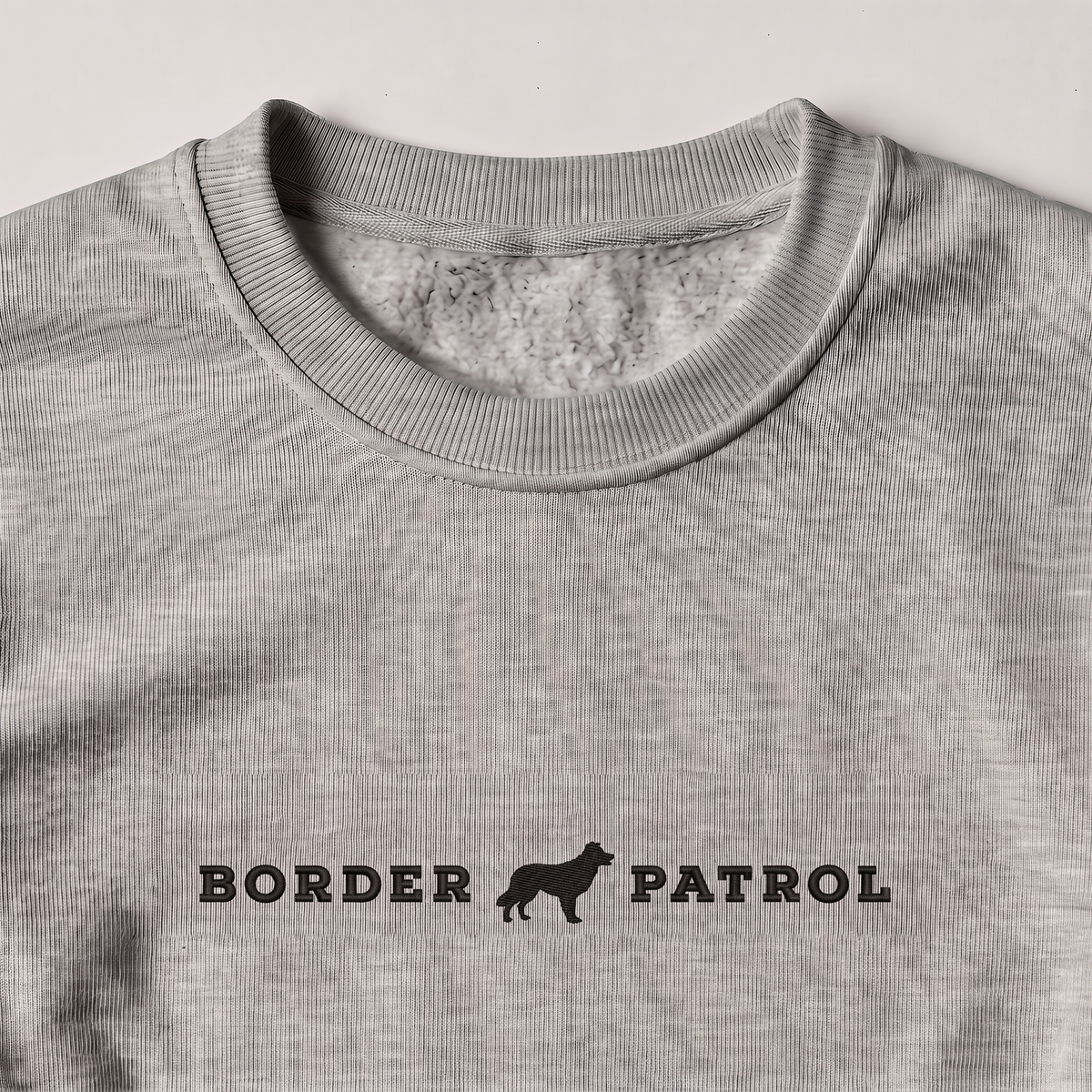 Border Patrol Border Collie embroidered sweatshirt, close-up of the embroidery