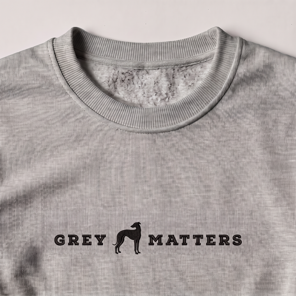 Grey Matters Greyhound embroidered sweatshirt, close-up of the embroidery