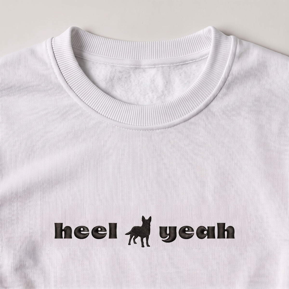 Heel Yeah Heeler embroidered sweatshirt, close-up of the embroidery