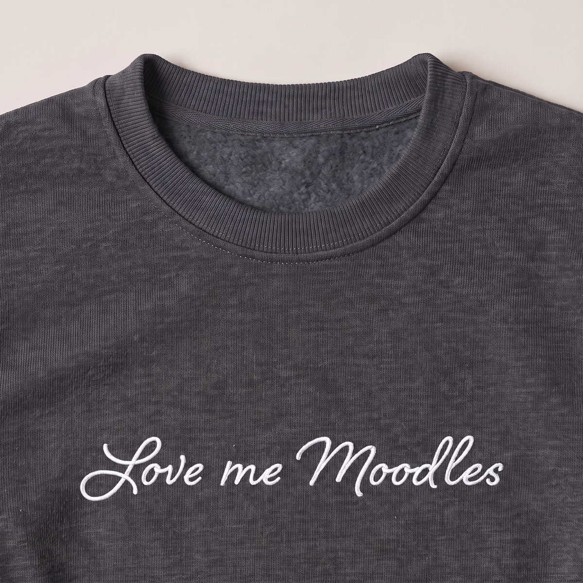 Love Me Moodles Moodle embroidered sweatshirt, close-up of the embroidery