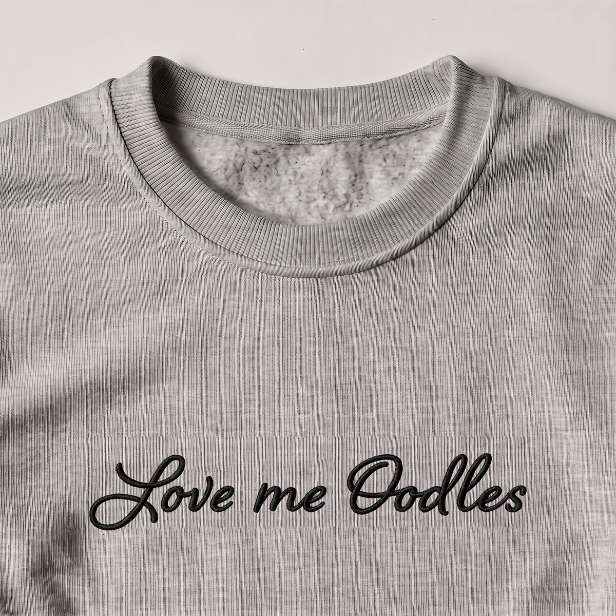Love Me Oodles Oodle embroidered sweatshirt, close-up of the embroidery