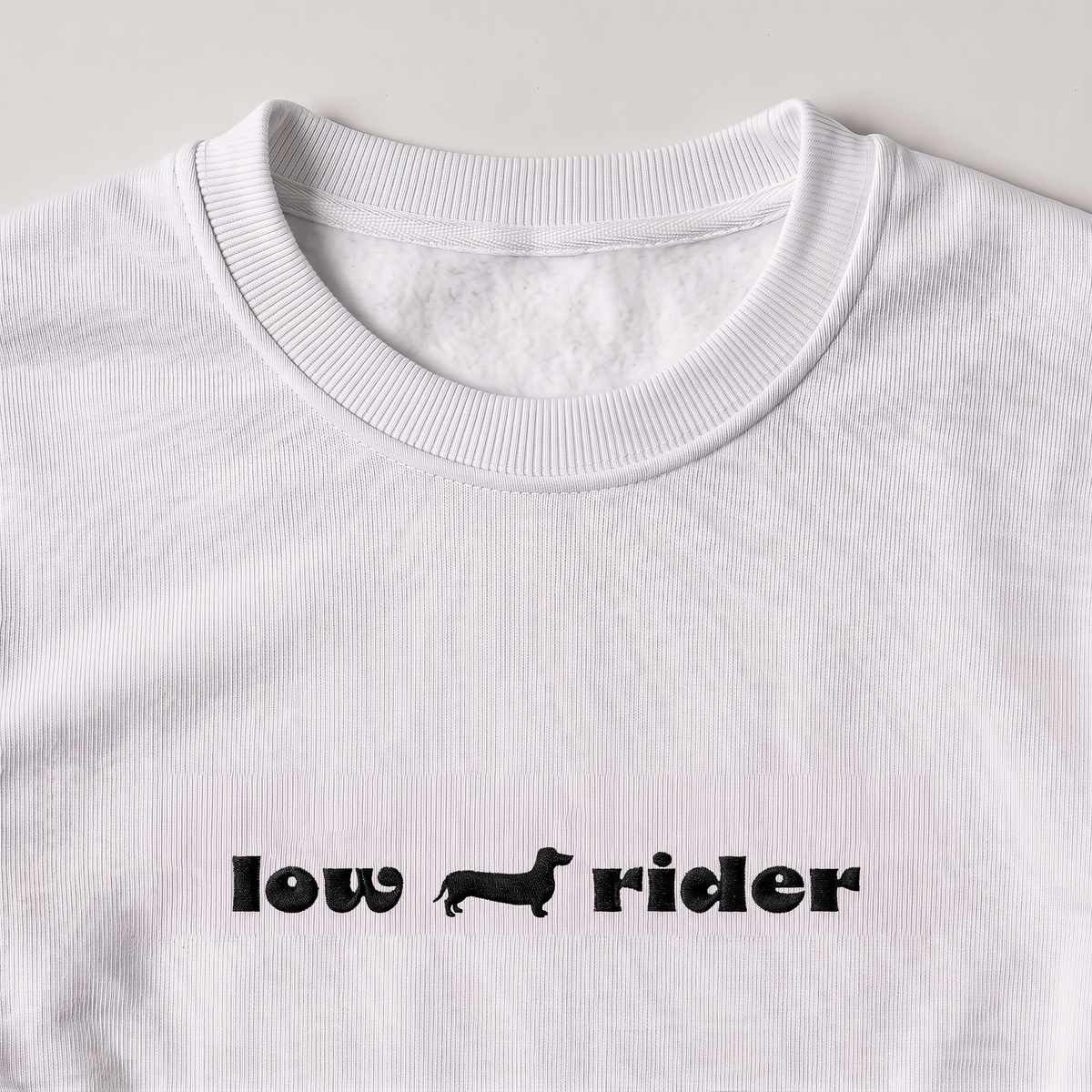 Low Rider Dachshund embroidered sweatshirt, close-up of the embroidery