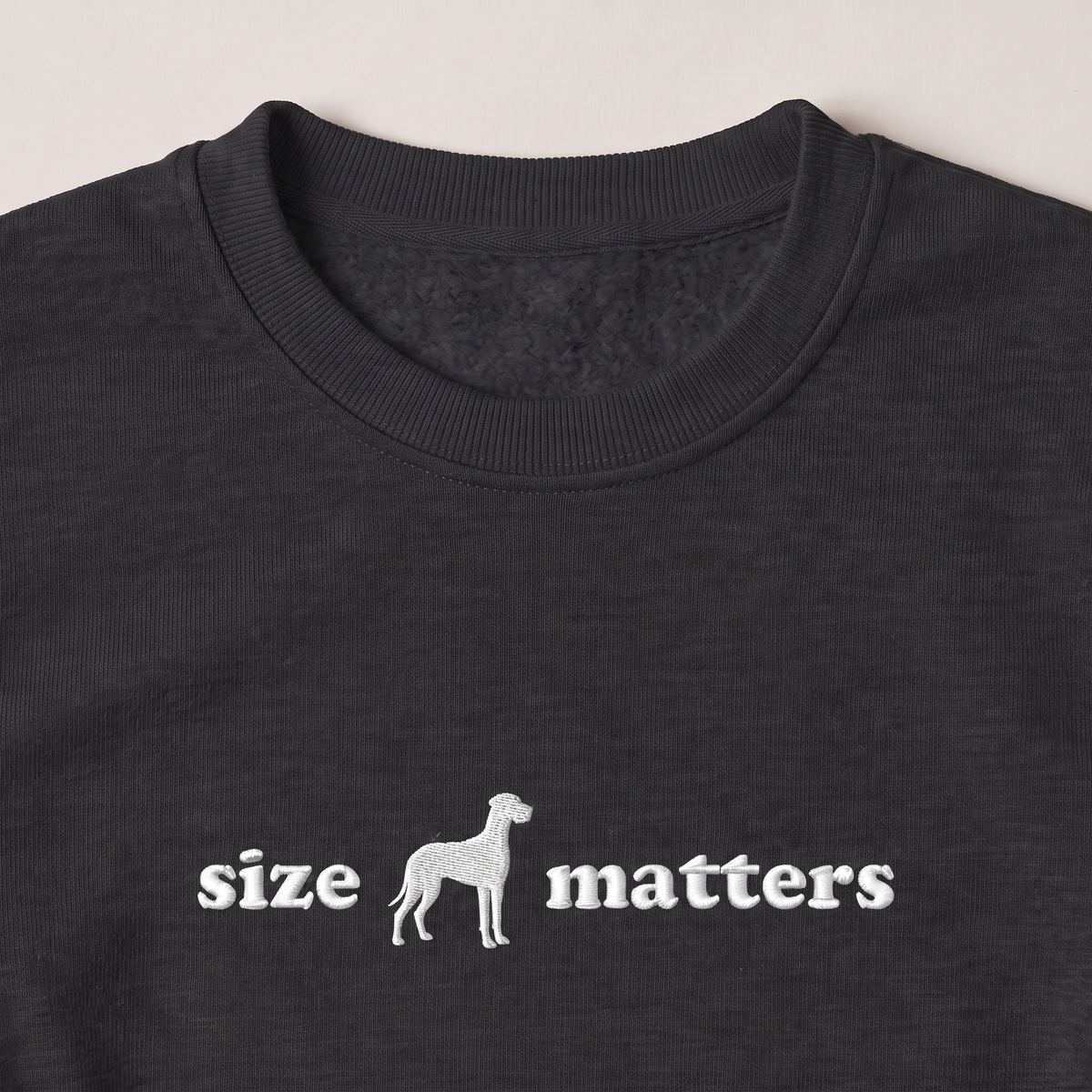 Size Matters Great Dane embroidered sweatshirt, close-up of the embroidery